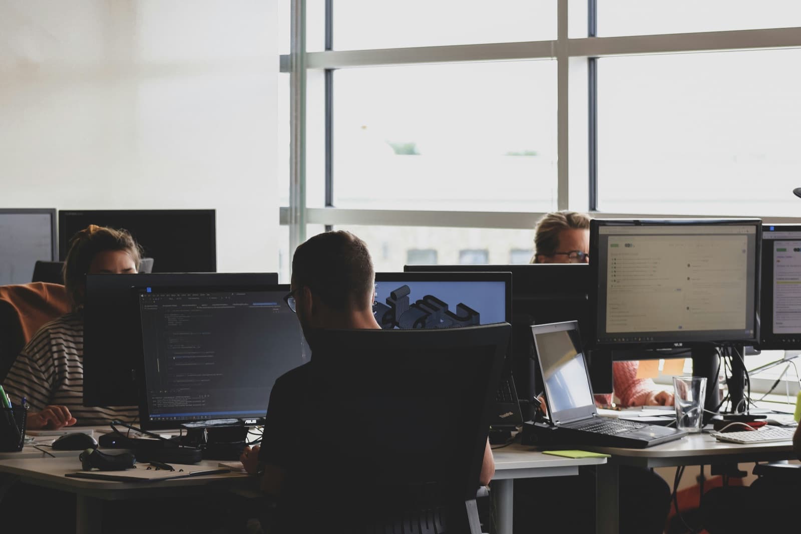 A team working at their desks in an open-plan office